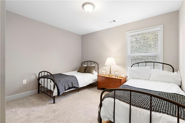 bedroom with light colored carpet