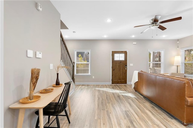 entryway with light hardwood / wood-style flooring and ceiling fan