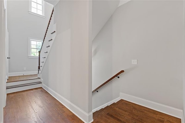 stairs with hardwood / wood-style flooring