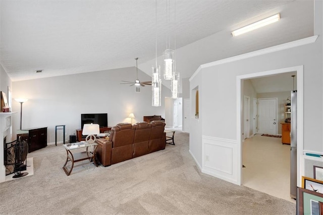 living room with vaulted ceiling, carpet floors, a ceiling fan, and visible vents