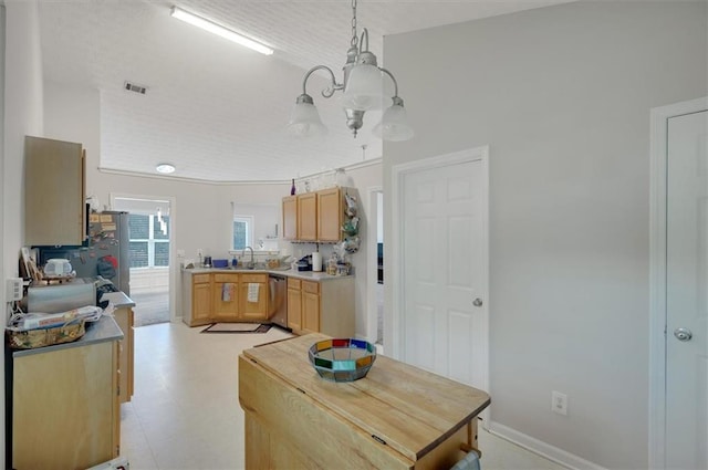kitchen with light brown cabinets, light countertops, dishwasher, visible vents, and pendant lighting