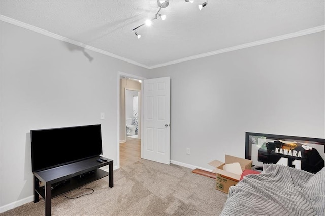bedroom featuring baseboards, ornamental molding, and carpet