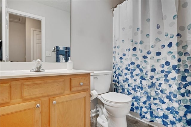 bathroom with vanity, tile patterned flooring, toilet, and a shower with curtain