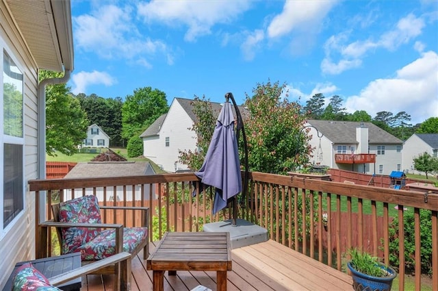 wooden deck featuring a residential view
