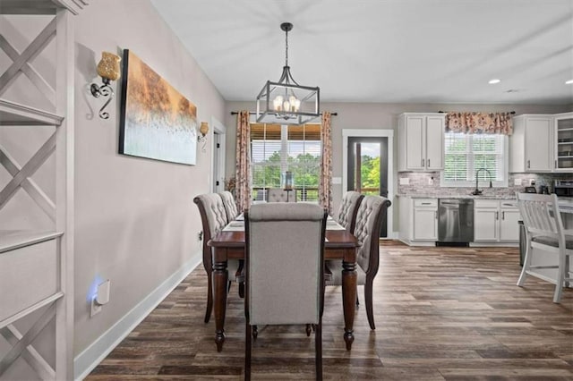 1423 Hillcrest Rd, Bowdon, GA 30108 - dining room with a chandelier, dark wood-style flooring, baseboards, and recessed lighting
