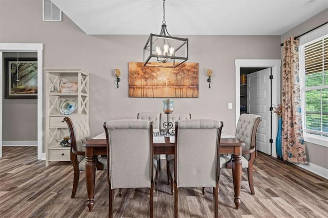 1423 Hillcrest Rd, Bowdon, GA 30108 - dining space with a chandelier, wood finished floors, and baseboards