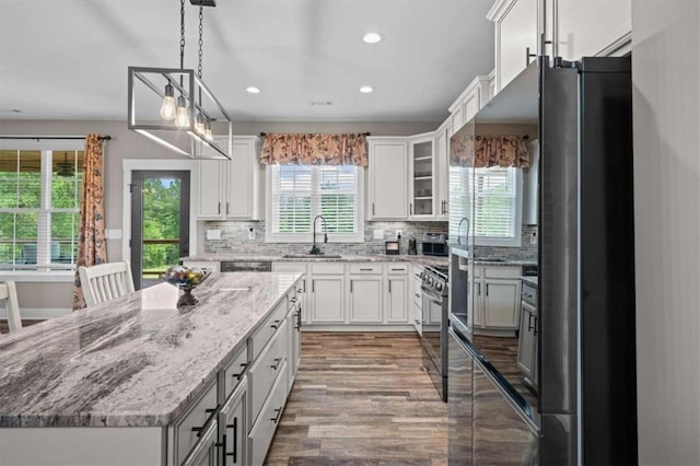 1423 Hillcrest Rd, Bowdon, GA 30108 - kitchen with appliances with stainless steel finishes, a sink, plenty of natural light, recessed lighting, and a kitchen island