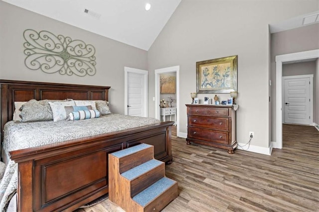 1423 Hillcrest Rd, Bowdon, GA 30108 - bedroom featuring baseboards, wood finished floors, and high vaulted ceiling