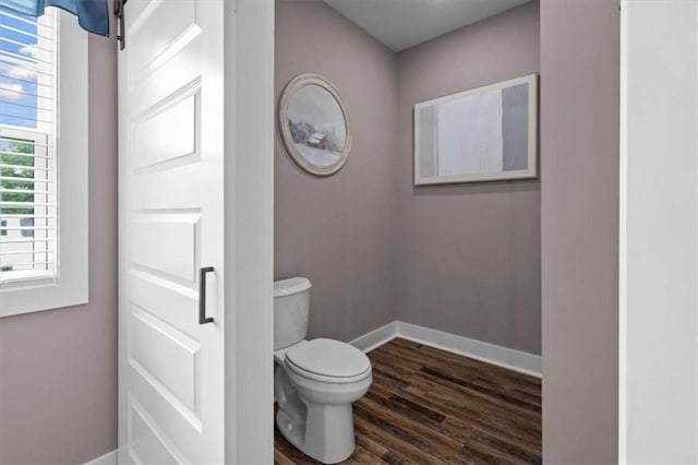 1423 Hillcrest Rd, Bowdon, GA 30108 - bathroom with toilet, wood finished floors, and baseboards