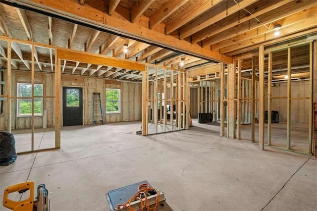 1423 Hillcrest Rd, Bowdon, GA 30108 - miscellaneous room with plenty of natural light and unfinished concrete flooring