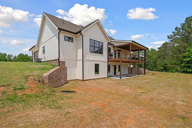 1423 Hillcrest Rd, Bowdon, GA 30108 - rear view of house featuring a lawn, central AC unit, a patio area, and a wooden deck