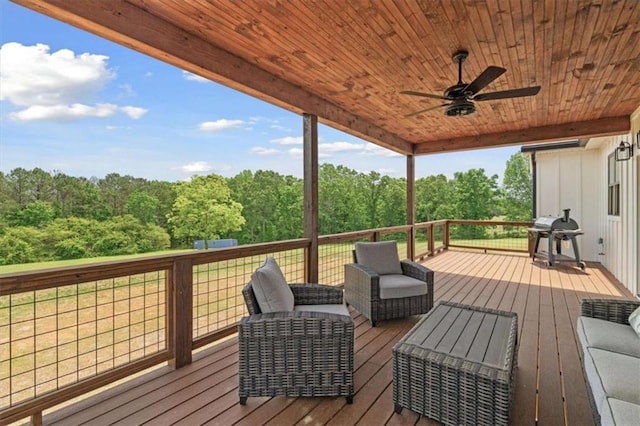 1423 Hillcrest Rd, Bowdon, GA 30108 - wooden deck with area for grilling, a ceiling fan, a view of trees, and an outdoor hangout area