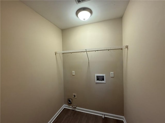 2728 Sandalwood Cir, Locust Grove, GA 30248 - laundry area with electric dryer hookup, dark wood-type flooring, washer hookup, baseboards, and laundry area
