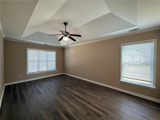 2728 Sandalwood Cir, Locust Grove, GA 30248 - empty room featuring a wealth of natural light, visible vents, a raised ceiling, and a ceiling fan