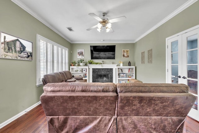 422 Inwood Trl, Lawrenceville, GA 30043 - living room with ornamental molding, a ceiling fan, dark wood-style floors, a fireplace, and french doors