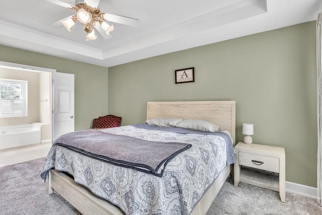 422 Inwood Trl, Lawrenceville, GA 30043 - bedroom with a tray ceiling, carpet floors, ornamental molding, ceiling fan, and baseboards