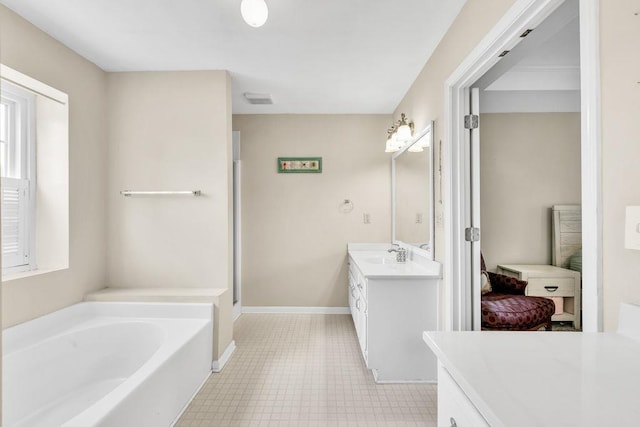422 Inwood Trl, Lawrenceville, GA 30043 - ensuite bathroom with vanity, a garden tub, baseboards, and a shower