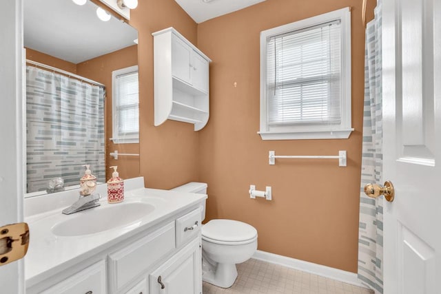 422 Inwood Trl, Lawrenceville, GA 30043 - bathroom featuring vanity, toilet, and baseboards