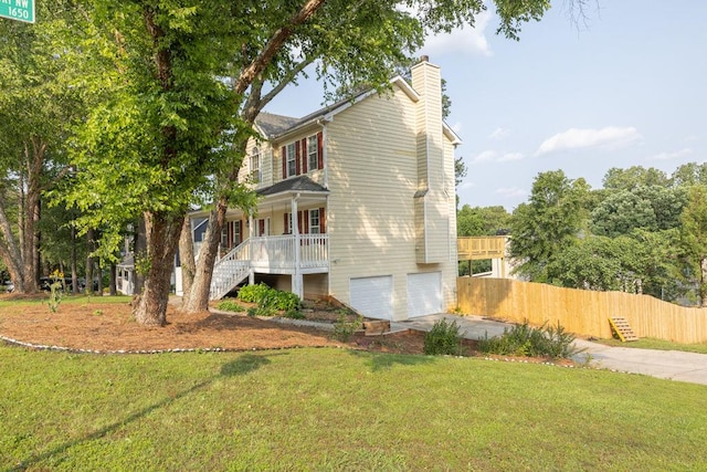 422 Inwood Trl, Lawrenceville, GA 30043 - view of property exterior featuring stairs, a chimney, concrete driveway, covered porch, and an attached garage
