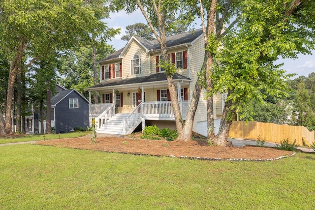 422 Inwood Trl, Lawrenceville, GA 30043 - colonial home featuring a porch, stairway, and an attached garage