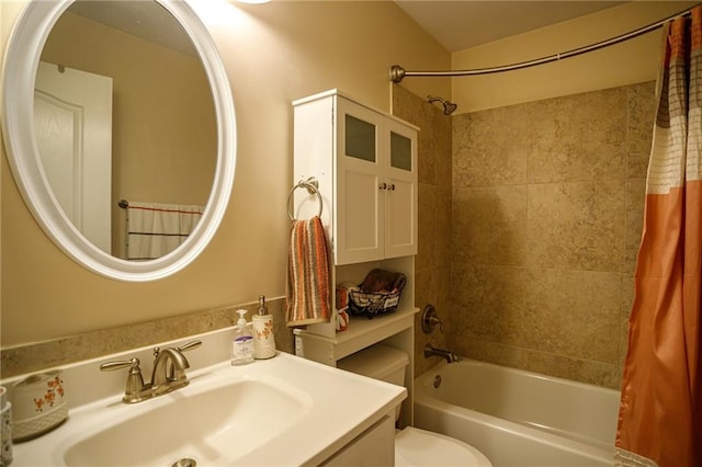 bathroom with vanity, toilet, and shower / bath combo with shower curtain