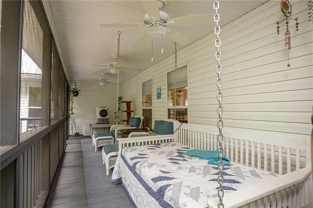 sunroom featuring a ceiling fan