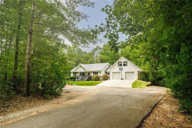 view of front of property with covered porch and concrete driveway