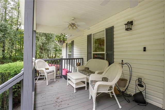 wooden deck featuring ceiling fan