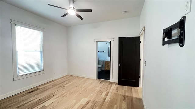 empty room with light hardwood / wood-style flooring and ceiling fan