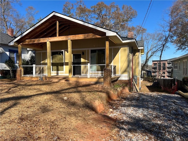 back of house with covered porch