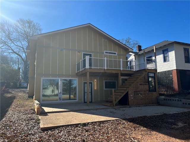 rear view of house with a patio area and french doors