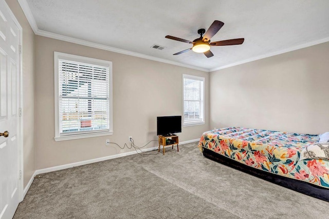 bedroom featuring crown molding, carpet flooring, and ceiling fan