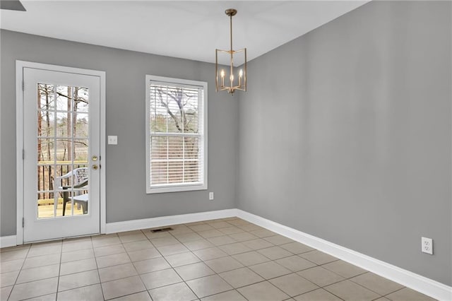 unfurnished dining area featuring an inviting chandelier, light tile patterned floors, visible vents, and baseboards