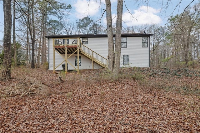 rear view of house with a deck and stairway