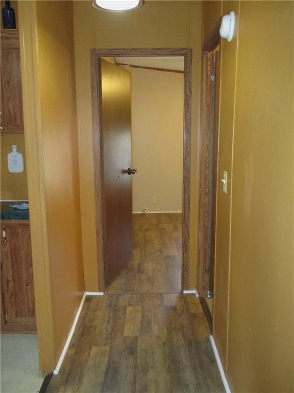 hall with dark hardwood / wood-style flooring