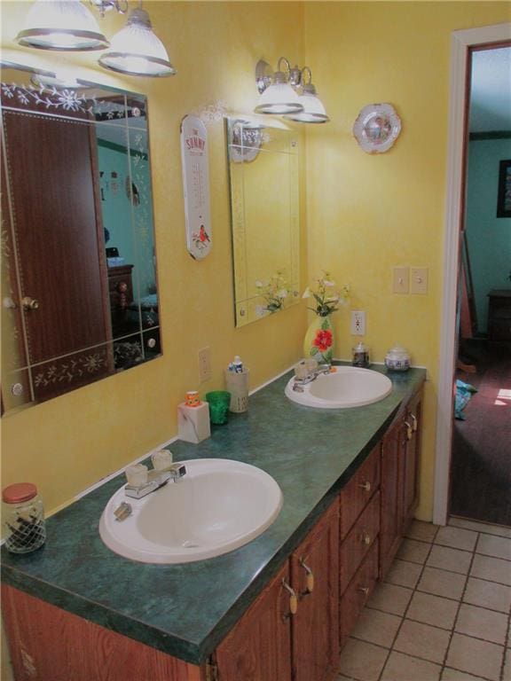 bathroom with tile patterned flooring and vanity