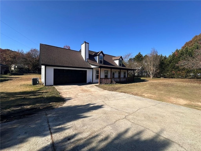 new england style home featuring a porch, a garage, central AC, and a front lawn