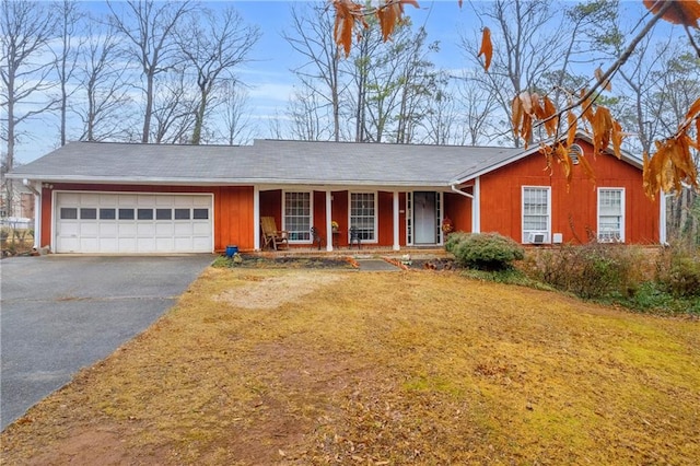 ranch-style home featuring a garage and a front yard