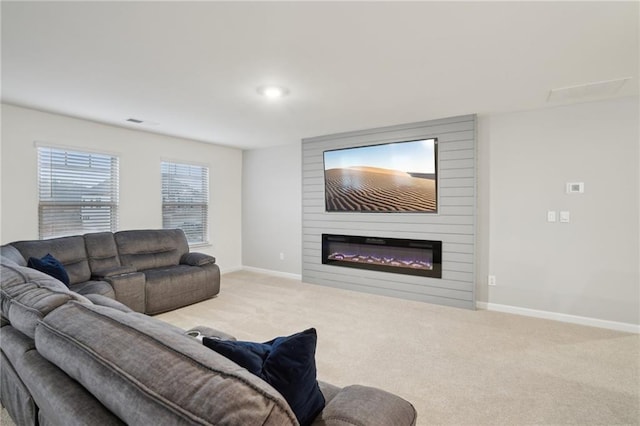 carpeted living room with a fireplace