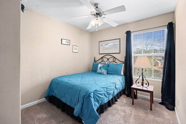 bedroom with light carpet and ceiling fan