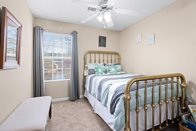 bedroom featuring ceiling fan and light carpet