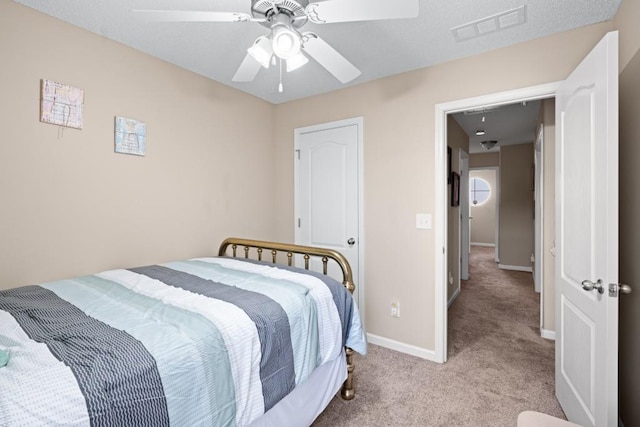 bedroom featuring ceiling fan and light carpet