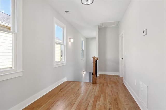 interior space featuring light wood-type flooring and a healthy amount of sunlight