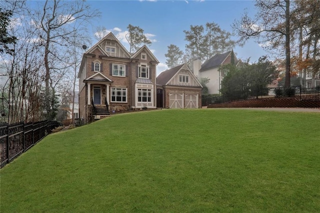 view of front of house with a garage, a chimney, a front lawn, and fence