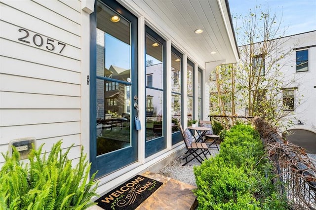 balcony featuring a porch and a sunroom