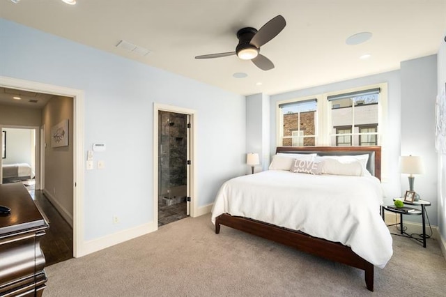 carpeted bedroom featuring visible vents, baseboards, and ceiling fan