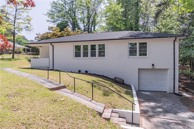 810 Parkway Dr SE, Smyrna, GA 30080 - view of front of home with a front lawn, driveway, fence, brick siding, and an attached garage