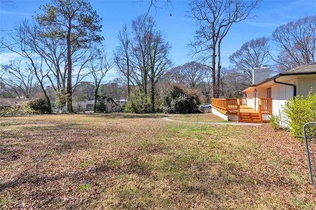 view of yard featuring a wooden deck