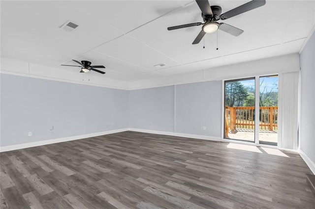 empty room featuring visible vents, ceiling fan, dark wood-type flooring, and baseboards