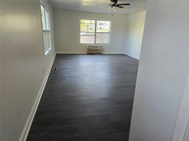 240 Varnes Ln, Lakemont, GA 30552 - empty room with dark wood-type flooring, a ceiling fan, and an AC wall unit